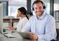 Call center, portrait and happy man on tablet in office for tech support, help desk and customer service. Face Royalty Free Stock Photo