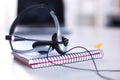 Call center service operator empty working place. Headset, glasses, keyboard and monitor at helpdesk employee workplace Royalty Free Stock Photo