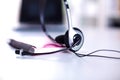 Call center service operator empty working place. Headset, glasses, keyboard and monitor at helpdesk employee workplace Royalty Free Stock Photo