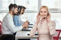 Call center service operator listening to headset. Royalty Free Stock Photo