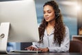 Call center, virtual assistant or woman typing on computer at telecom customer services office job help desk. Microphone Royalty Free Stock Photo