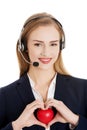 Call center woman holding heart Royalty Free Stock Photo