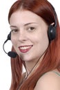 Call center : young adult female woman telephone headset, smiling, looking at camera, white background Royalty Free Stock Photo