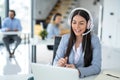 Call center worker communicating with client trying to sell company products during online meeting at office