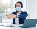 Call center worker with covid stretching with mask at work and woman resting while consulting with people online on a Royalty Free Stock Photo