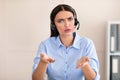 Call Center Worker Girl Talking With Discontented Customer In Office