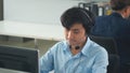 Call center young employee working with headset, Smiling customer support operator team at work surrounded Royalty Free Stock Photo