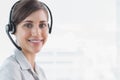 Call centre agent smiling at camera Royalty Free Stock Photo