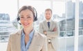 Call centre agent standing with colleague behind her Royalty Free Stock Photo