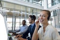 Call centre agents working in open plan office Royalty Free Stock Photo