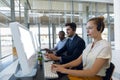 Call centre agents working in open plan office