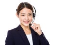 Call centre operator with hand hold with microphone Royalty Free Stock Photo
