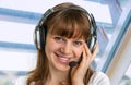 Call centre operator with headset at workplace in call center Royalty Free Stock Photo