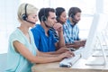 Call centre workers on their laptops Royalty Free Stock Photo