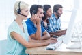 Call centre workers on their laptops Royalty Free Stock Photo