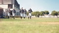 Call it a field of dreams. a group of young men walking onto a baseball field.