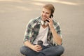 Call friend. Wellbeing and health. Having coffee break. Man sit on ground while drinking coffee. Relax and recharge Royalty Free Stock Photo