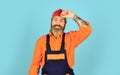 Call master. Renovation concept. Man skillful worker. Laborer. Repairman experienced worker. Help services. Handsome Royalty Free Stock Photo