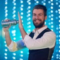 They call me the mix master. Portrait of a handsome young bartender mixing drinks in a nightclub. Royalty Free Stock Photo