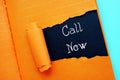 Call Now phrase on the piece of paper Royalty Free Stock Photo