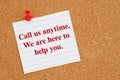 Call us anytime on lined rule paper on corkboard Royalty Free Stock Photo