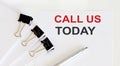 Call us today time written on a white page Royalty Free Stock Photo