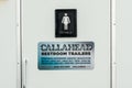 Callahead Restroom Trailers sign on a portable restroom