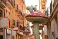 Street of the mushrooms. It is a narrow road with large statues of cartoon mushrooms. Alicante old town, Costa Blanca, Spain.