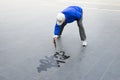 Calligrapher in Beijing. Hobby calligrapher practices writing a text on the floor with a wet brush. He has to work quickly. Royalty Free Stock Photo