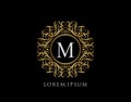 Calligraphic Badge with Letter M Design. Ornamental luxury golden logo design vector illustration