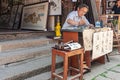 Calligraphy Artist with his works in street of Tongli, China