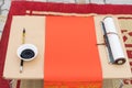 Calligraphy instruments with red paper, black ink, brush...Calligraphy is oriental culture in Lunar New Year