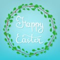 Calligraphy Lettering Happy Easter on Blue Background. Beautiful Floral Frame. Circle Frame from Green Branches. Vector. Royalty Free Stock Photo