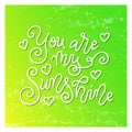 Calligraphy lettering of You are my sunshine in white on yellow green background with texture Royalty Free Stock Photo