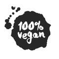 Calligraphy One Hundred Percent Vegan Label on a Black Inkblot