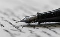 Calligraphy Pen With a Sheet of Handwritten Paper. Classic Fountain Pen Royalty Free Stock Photo