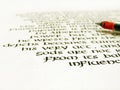Calligraphy pen and writing on white paper Royalty Free Stock Photo