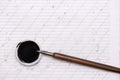Calligraphy sheets, nibs, paper, ink on a wooden background. empty copybook. top view, flat lay.