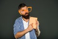 Calling attention to his manual. Book nerd wearing fancy glasses. Bearded man in party glasses with lesson book. Study Royalty Free Stock Photo