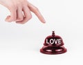 Calling for love concept. Woman ringing in red valentine s bell