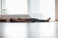 Calm of Asian indian woman practice yoga Dead Body or Savasana pose with meditation smile at home Feeling so comfortable and relax