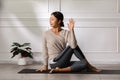 Calm of Asian woman in sportwear stretching muslce to warm up breathing and meditation with yoga at home,Healthy woman doing yoga Royalty Free Stock Photo