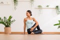 Calm of Asian woman in sportwear stretching muslce to warm up breathing and meditation with yoga at home.Healthy female doing yoga Royalty Free Stock Photo