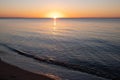 Calm bay waters at golden sunset. Royalty Free Stock Photo