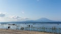 Calm beach and seaweed farm with the Gunung Agung Volcano in the background in Nusa Penida, in Bali, Indonesia.