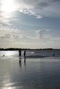 Calm beach during sunset. People chatting during sunset Royalty Free Stock Photo