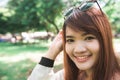 Calm beautiful smiling young woman with ponytail enjoying fresh air outdoor. Royalty Free Stock Photo