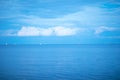 Calm blue sea with ships.