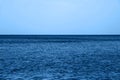 Calm Blue sea waves soft surface Ocean And Blue Sky in classic blue trendy color. background. Color of the year 2020