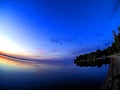 Calm blue sunset sky over the lake, calm surface of water, lake Uvildy, Fisheye Royalty Free Stock Photo